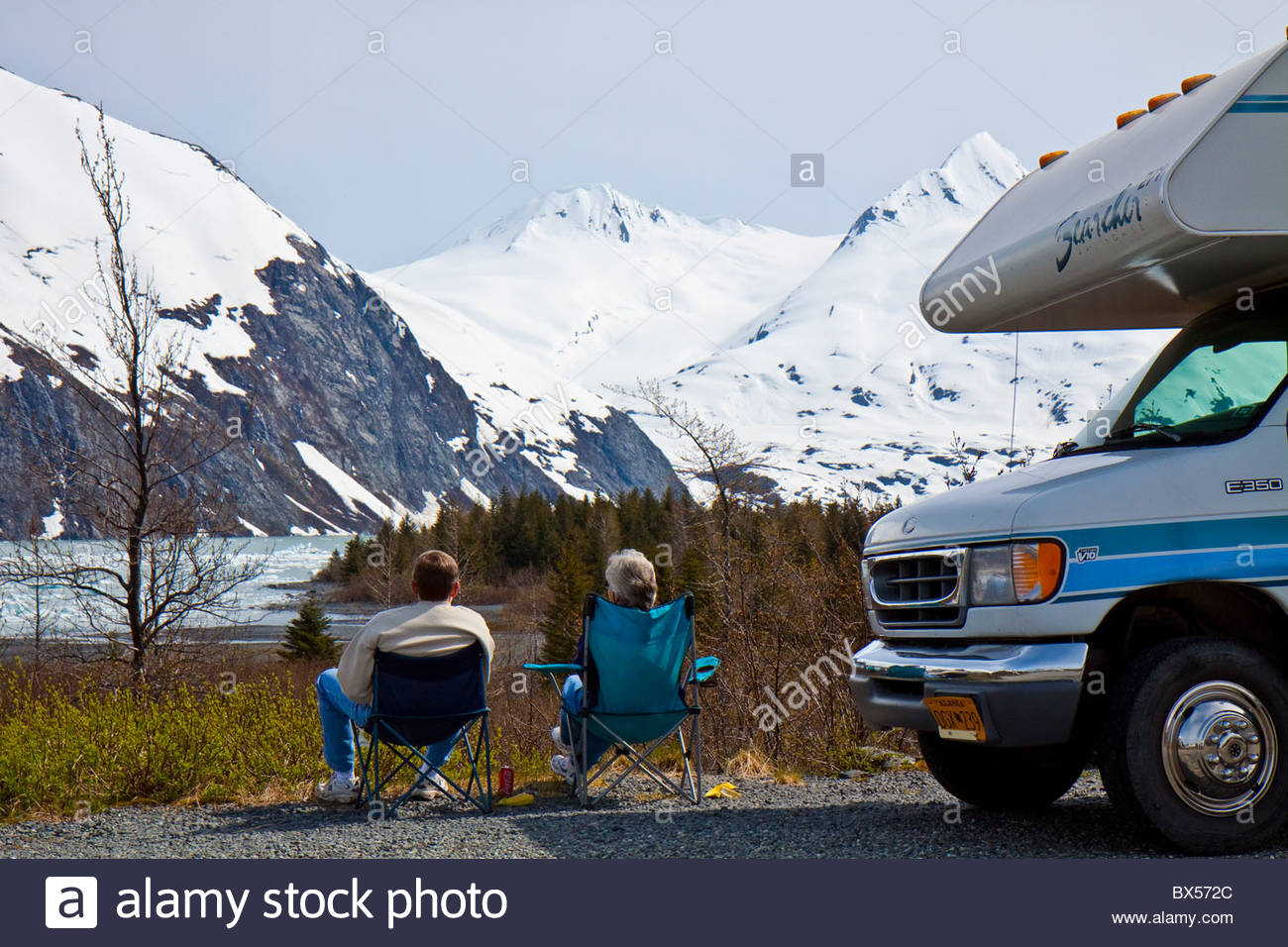 man-and-woman-relaxing-enjoying-the-view-of-portage-lake-BX572C.jpg