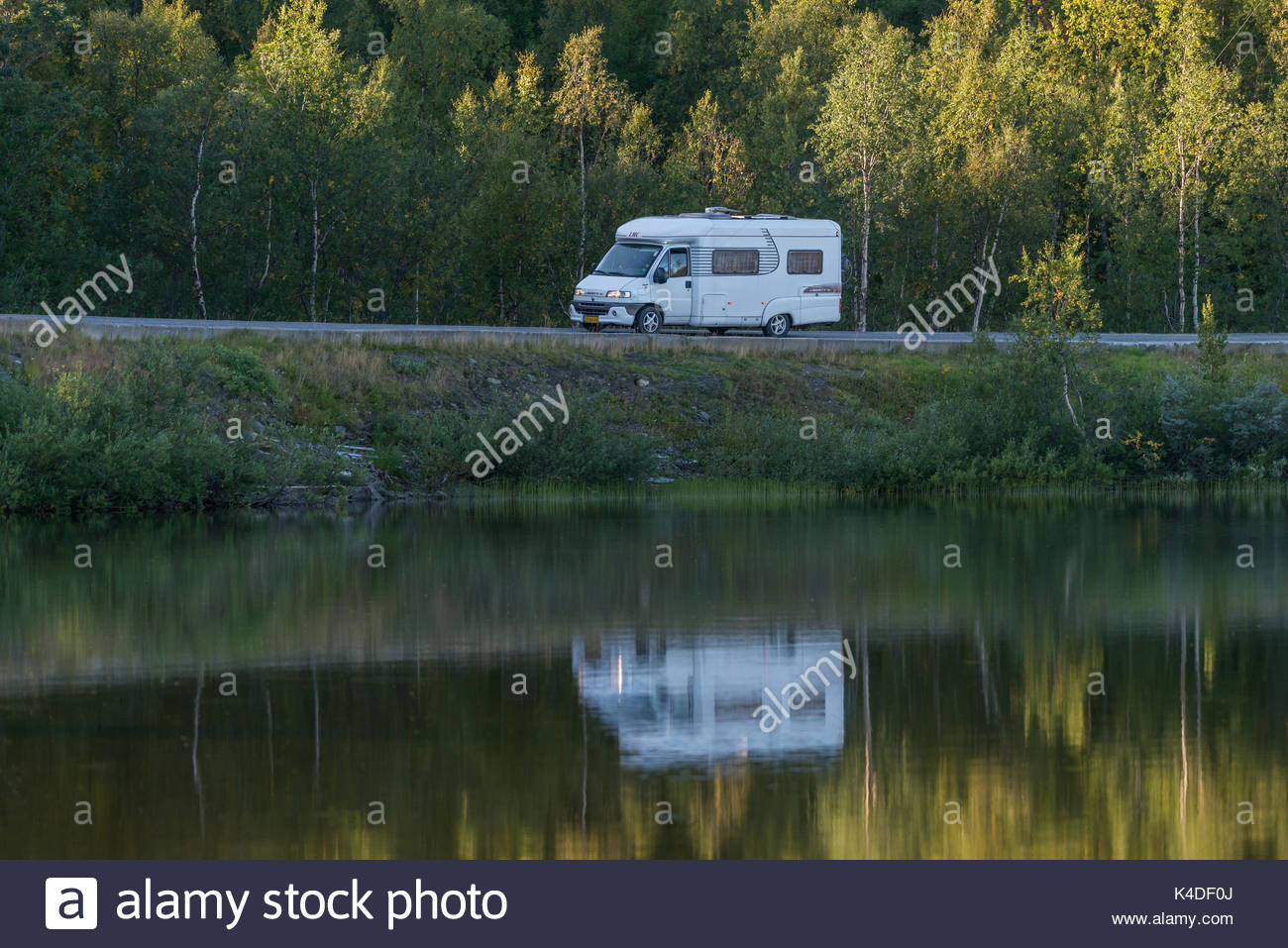 tourists-driving-a-white-rv-motorhome-on-european-road-in-alta-norway-K4DF0J.jpg